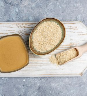 bowl-tahini-with-sesame-seeds-concrete-surface_114579-5518-1