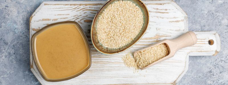 bowl-tahini-with-sesame-seeds-concrete-surface_114579-5518-1