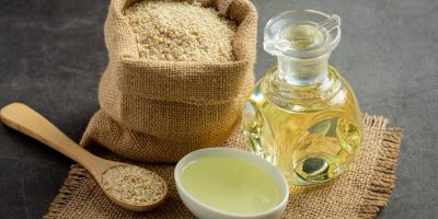 sesame-oil-sesame-seeds-dark-background_1150-45340